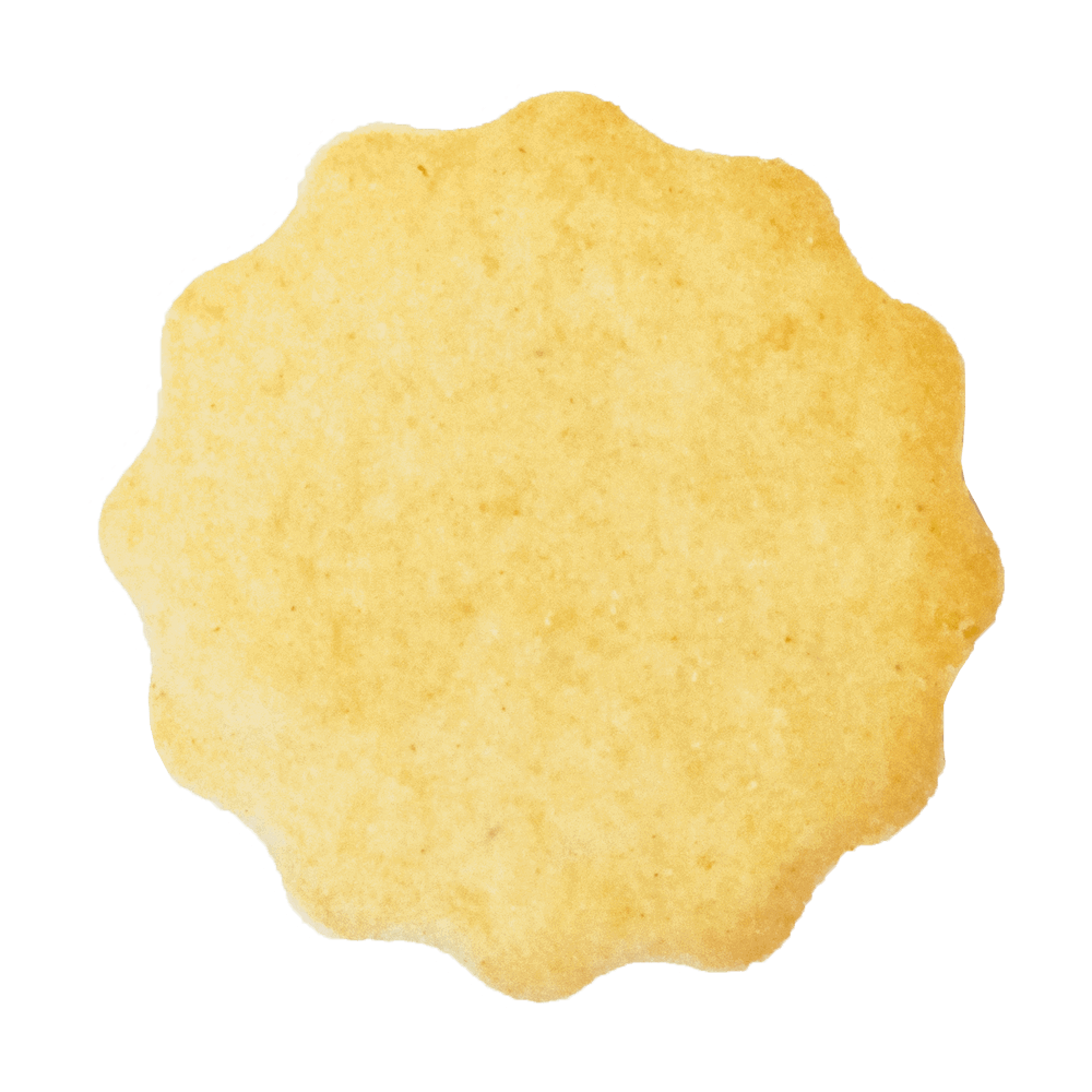 Ausstechmatten für die Plätzchenproduktion Ausgestochenes Plätzchen mit dem Muster gewellter Kreis