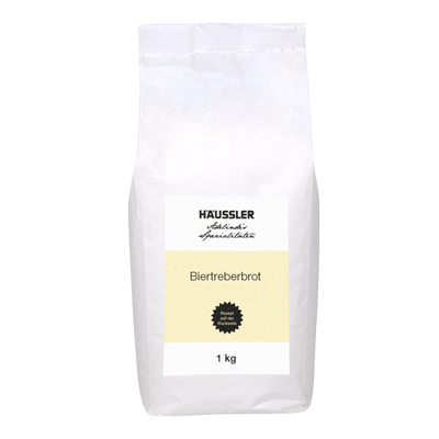 Weiße Verpackung mit gelbem Aufkleber mit der Aufschrift Biertreberbrot 1 k