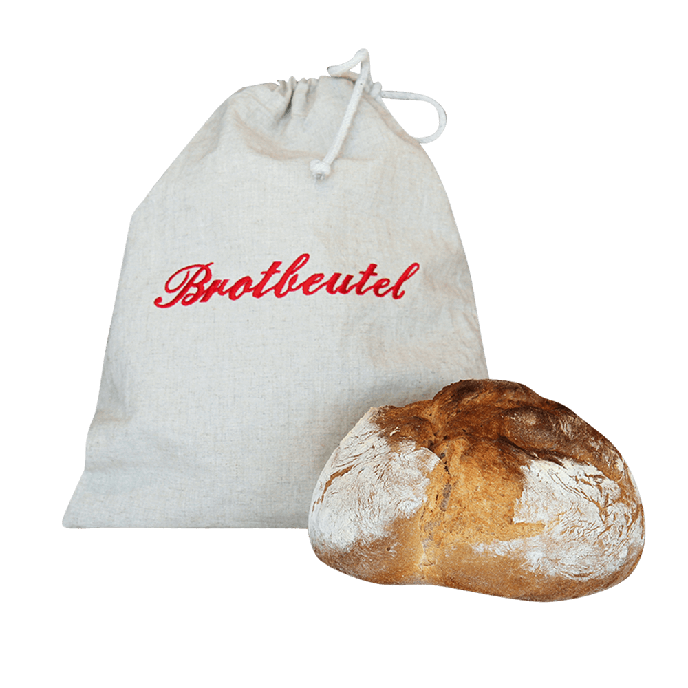 Brotbeutel mit Kordel und rotem Schriftzug "Brotbeutel" und einem frisch gebackenen Brot im Vordergrund