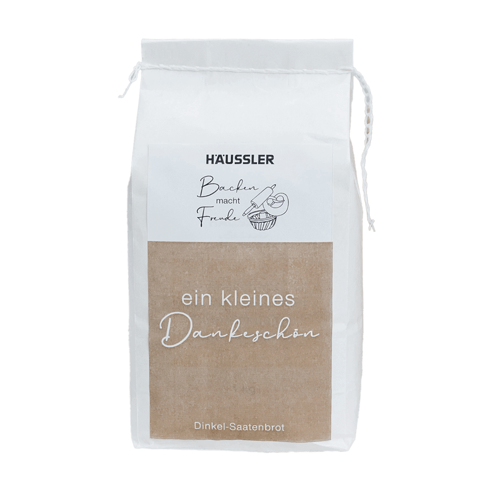 Weiße Verpackung mit braunem Aufkleber: Mehl-Geschenk: ein kleines Dankeschön (Dinkel-Saatenbrot) 1 Kilogramm