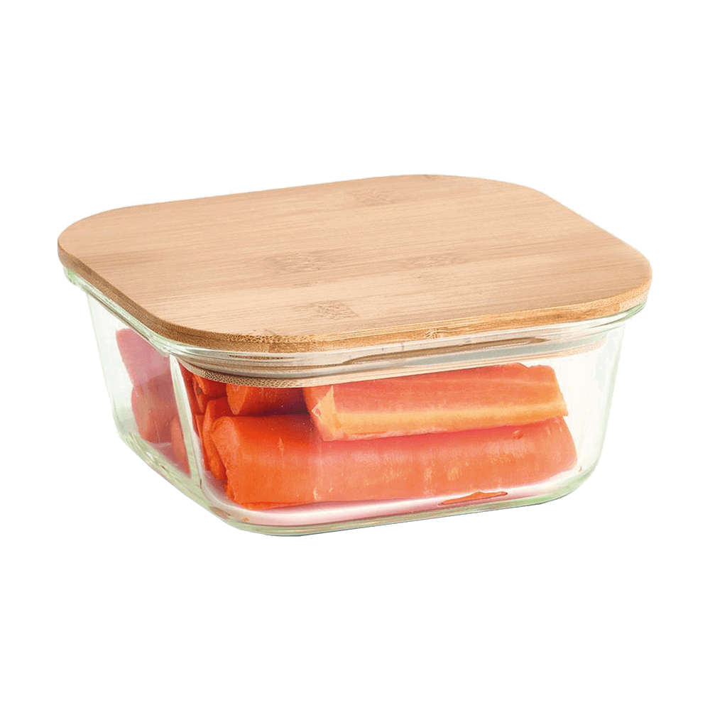 Vorratsbehälter mit Bambusdeckel Glas-Vorratsdose mit Bambusdeckel. Es werden Karotten darin aufbewahrt.