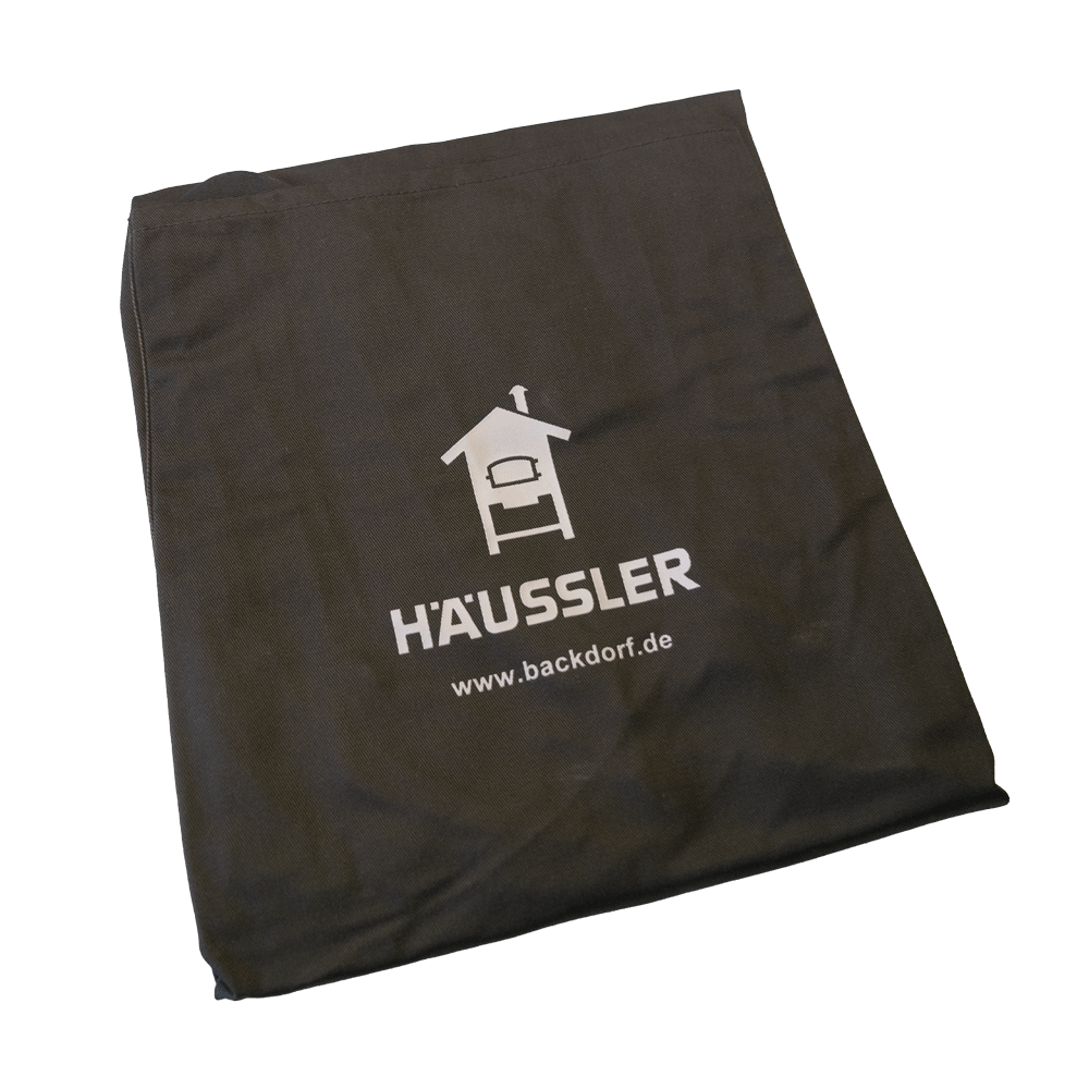 Häussler Schürze, dunkelbraun zusammengefaltete braune Schürze mit Häussler Logo und Backhäuschen Illustration