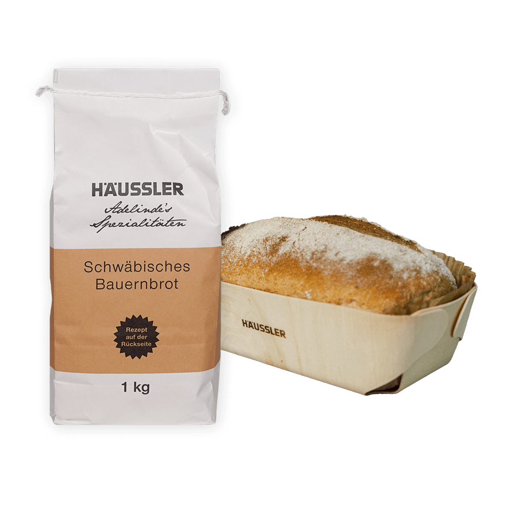 Mehltüte mit Brot in einer Holzbackform