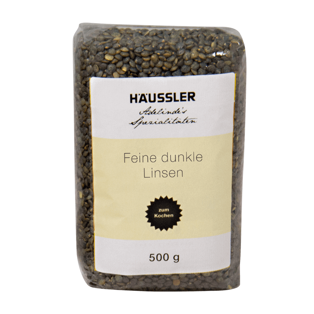 Feine dunkle Linsen 500 g Durchsichtige Verpackung mit der Aufschrift Feine dunkle Linsen 500 Gramm