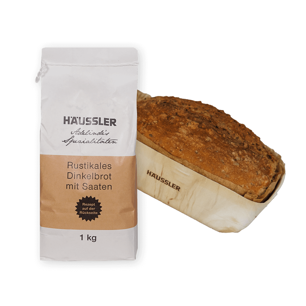 Mehltüte mit Brot in einer Holzbackform