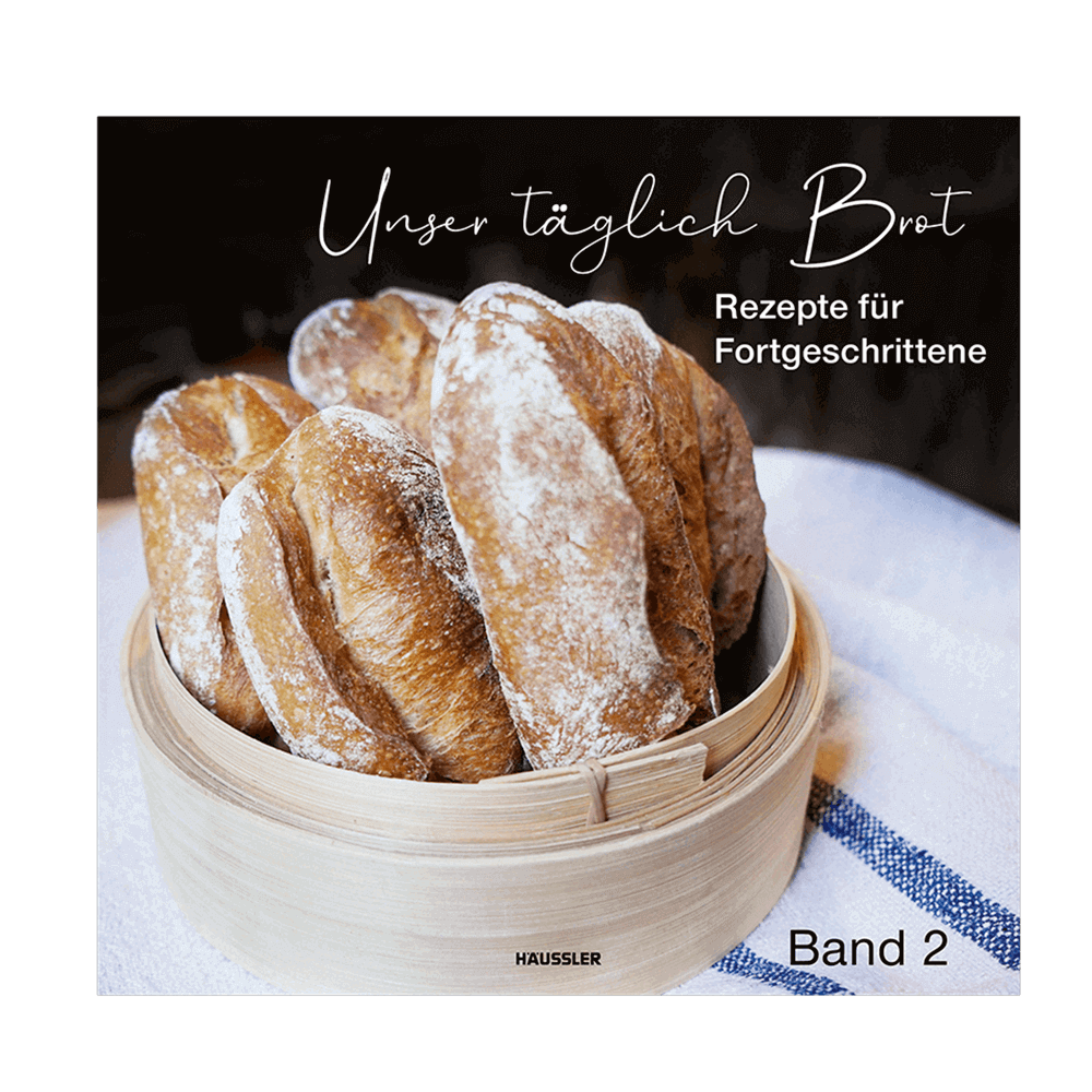 Häussler-Buch: Unser täglich Brot Band 2 Cover-Bild des Häussler-Buches: Unser täglich Brot Band 2. Darauf ist knuspriges Kleingebäck in einem Korb zu sehen. Der Korb steht auf einem weißen Leinentuch mit blauen Streifen