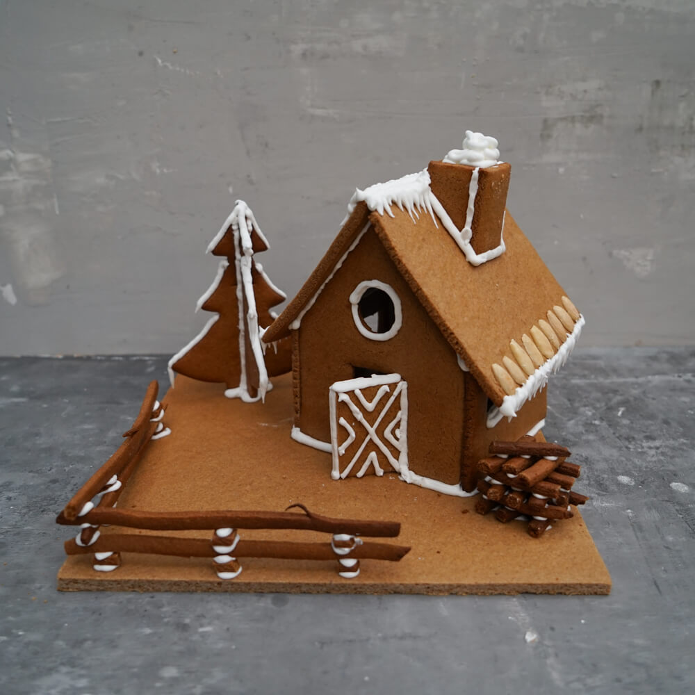 Rezept für Lebkuchenhaus selbstgemachtes Lebkuchenhaus mit Zuckerguss verziert